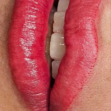 PMU lips by Tanya in a bright rosy red